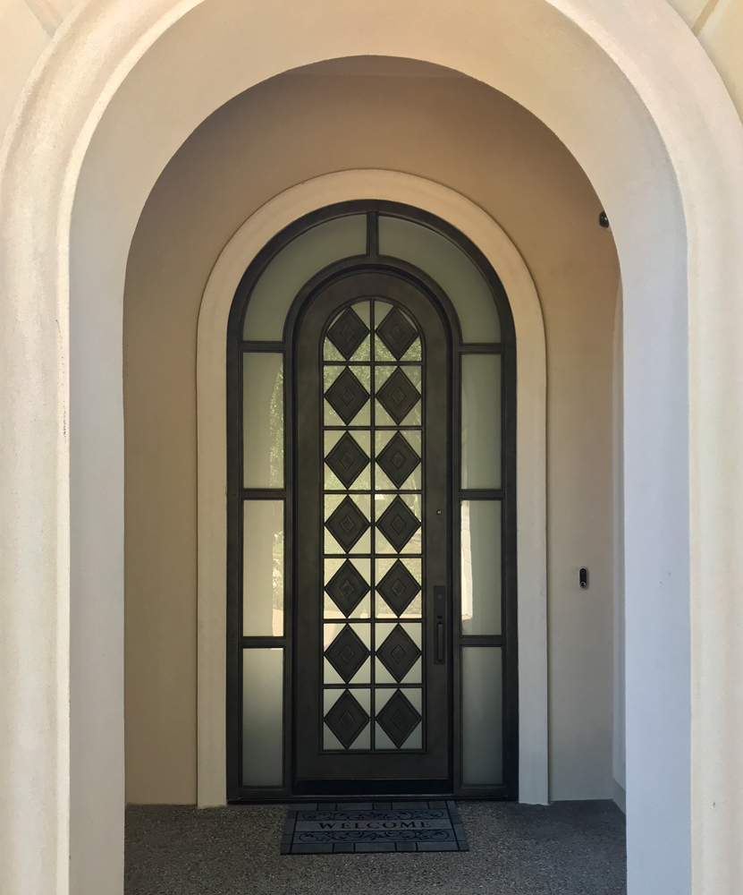 Custom Arched Door with Surrounding Windows
